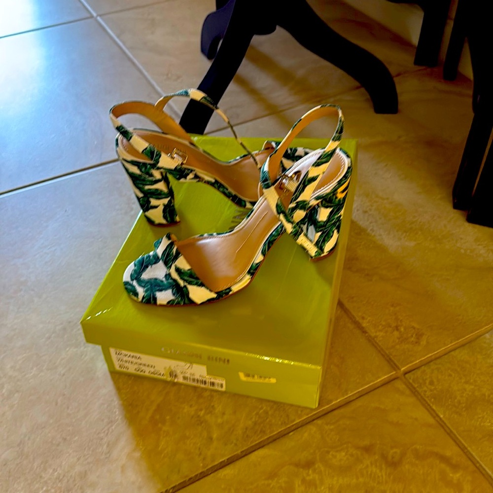 Women’s shoes. White with green leaves. Beautiful